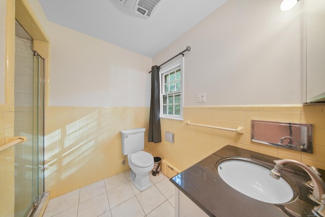 35 Flax Mill Ter, Milford, CT 06461 - full bath featuring tile walls, tile patterned flooring, a shower stall, vanity, and wainscoting