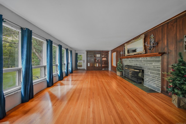 35 Flax Mill Ter, Milford, CT 06461 - unfurnished living room with a fireplace and light wood-type flooring
