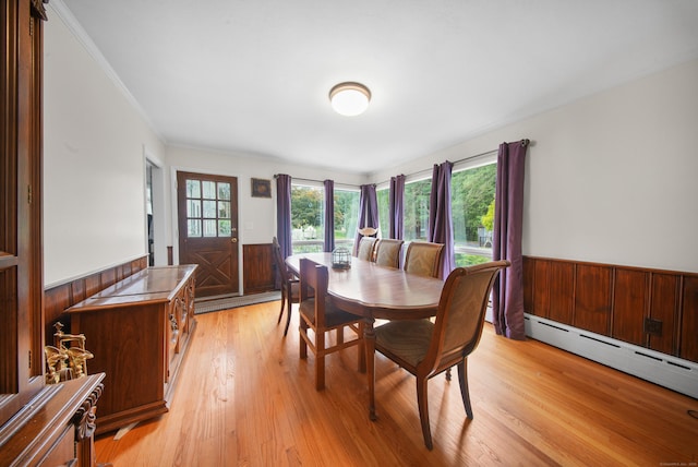 35 Flax Mill Ter, Milford, CT 06461 - dining room featuring wainscoting, wooden walls, light wood finished floors, a baseboard heating unit, and crown molding