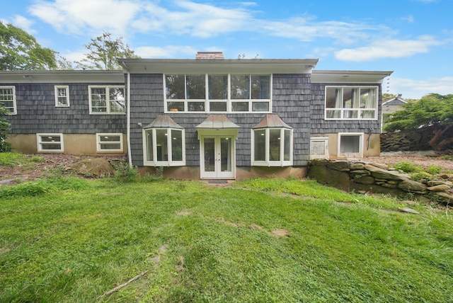 35 Flax Mill Ter, Milford, CT 06461 - rear view of property featuring french doors, a lawn, and a chimney