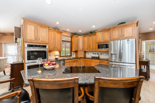 90 Soundview Ave, Shelton, CT 06484 - kitchen with appliances with stainless steel finishes, a kitchen breakfast bar, recessed lighting, and a spacious island