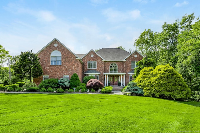 90 Soundview Ave, Shelton, CT 06484 - colonial-style house featuring brick siding and a front lawn