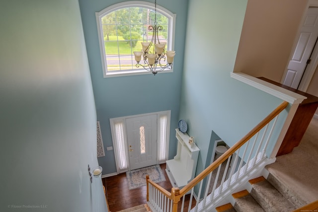 148 Evergreen Rd, Cromwell, CT 06416 - entrance foyer featuring a chandelier, stairway, a high ceiling, and wood finished floors