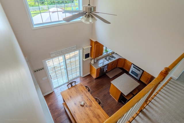 148 Evergreen Rd, Cromwell, CT 06416 - living room with a towering ceiling, a ceiling fan, and dark wood-type flooring