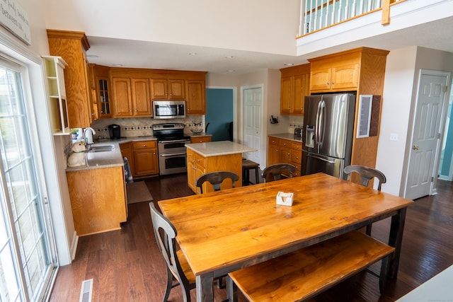148 Evergreen Rd, Cromwell, CT 06416 - dining area with dark wood-style flooring and a towering ceiling