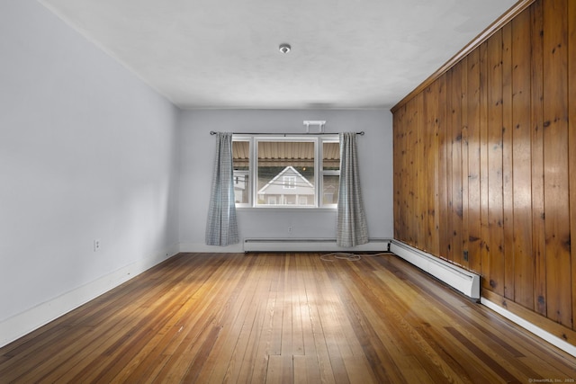 1691 State St, Hamden, CT 06517 - unfurnished room with wood-type flooring, a baseboard radiator, and a baseboard heating unit