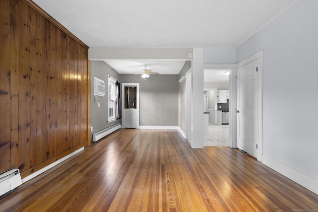 1691 State St, Hamden, CT 06517 - unfurnished room featuring a baseboard radiator, hardwood / wood-style floors, a baseboard heating unit, a ceiling fan, and an AC wall unit