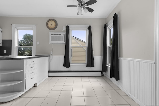 1691 State St, Hamden, CT 06517 - kitchen featuring a wainscoted wall, a wall mounted AC, a ceiling fan, baseboard heating, and healthy amount of natural light