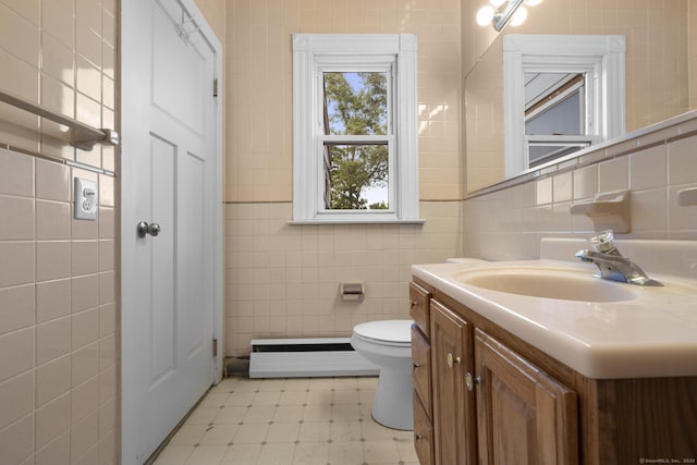 1691 State St, Hamden, CT 06517 - bathroom featuring tile walls, vanity, tile patterned floors, and baseboard heating