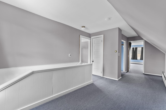 1691 State St, Hamden, CT 06517 - hall with lofted ceiling, dark colored carpet, and a baseboard heating unit