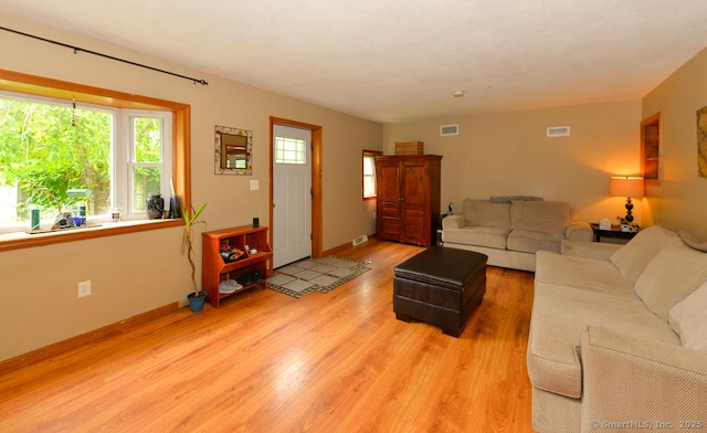 215 White Birch Dr, Southbury, CT 06488 - living area featuring light wood finished floors and baseboards