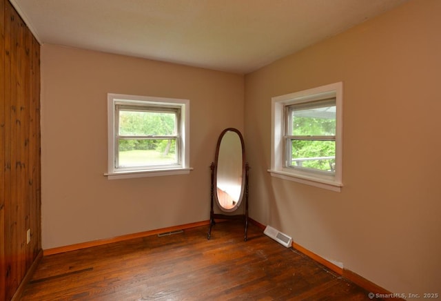 215 White Birch Dr, Southbury, CT 06488 - empty room with plenty of natural light and dark wood-style flooring