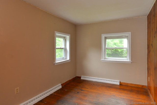 215 White Birch Dr, Southbury, CT 06488 - empty room featuring a baseboard radiator and dark wood-type flooring