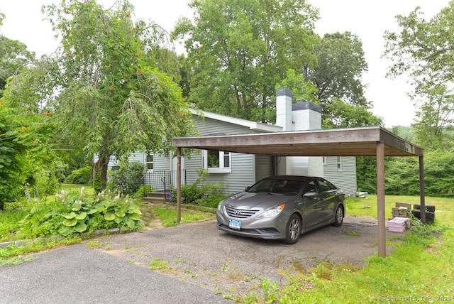 215 White Birch Dr, Southbury, CT 06488 - view of parking featuring a carport and asphalt driveway