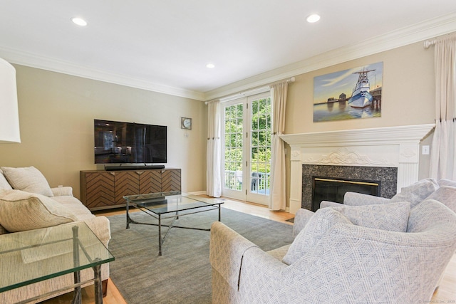 61 Brookview Ct, Groton, CT 06340 - living area with crown molding, wood finished floors, recessed lighting, and a premium fireplace