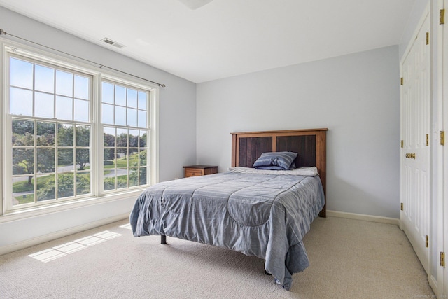 61 Brookview Ct, Groton, CT 06340 - bedroom featuring light carpet and baseboards