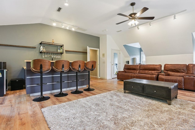 61 Brookview Ct, Groton, CT 06340 - living area featuring rail lighting, vaulted ceiling, ceiling fan, and wood finished floors