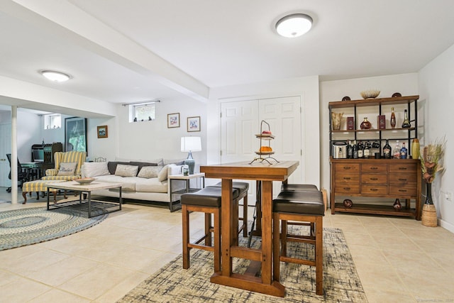 61 Brookview Ct, Groton, CT 06340 - living area featuring light tile patterned flooring and baseboards