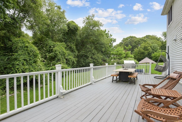 61 Brookview Ct, Groton, CT 06340 - wooden terrace featuring outdoor dining space, a lawn, and view of wooded area