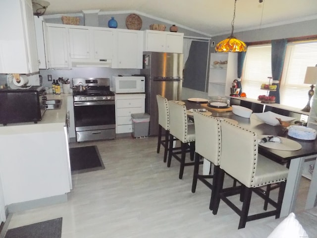 61 Elm St, East Windsor, CT 06088 - kitchen featuring stainless steel appliances, vaulted ceiling, crown molding, white cabinets, and light wood-type flooring