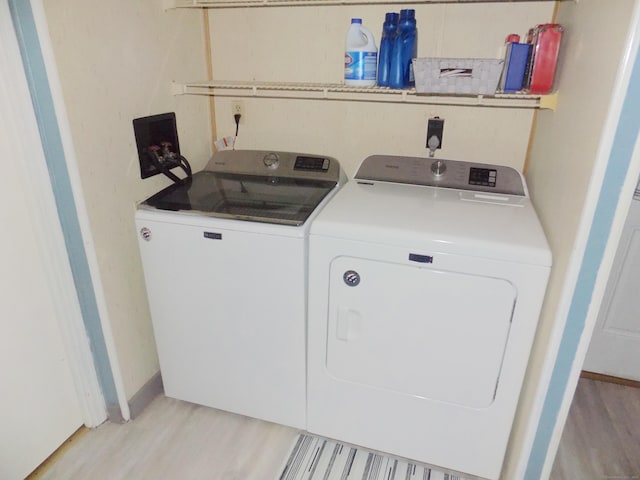 61 Elm St, East Windsor, CT 06088 - washroom featuring separate washer and dryer and light wood finished floors