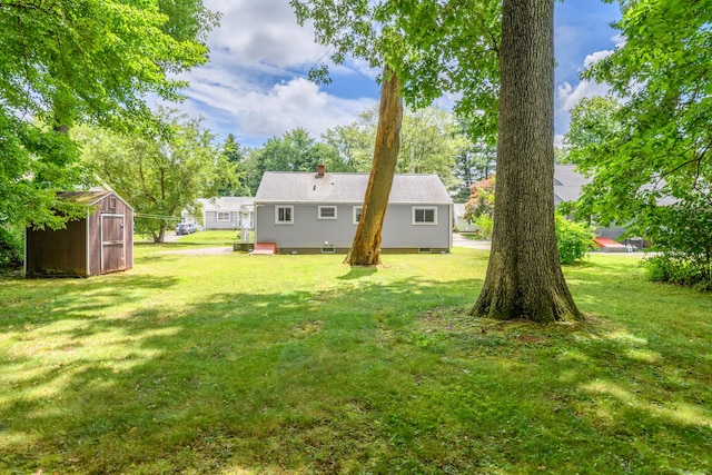 76 Landers Rd, East Hartford, CT 06118 - back of house with a storage shed and a yard