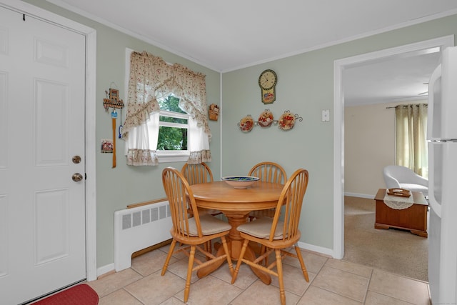 76 Landers Rd, East Hartford, CT 06118 - dining area featuring radiator heating unit, crown molding, and light tile patterned flooring
