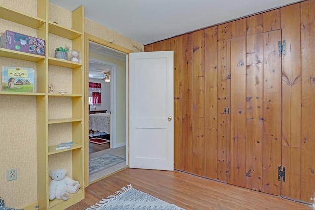 76 Landers Rd, East Hartford, CT 06118 - bedroom featuring wood finished floors and wooden walls