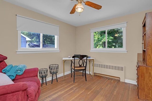 76 Landers Rd, East Hartford, CT 06118 - living area with radiator, wood-type flooring, and ceiling fan