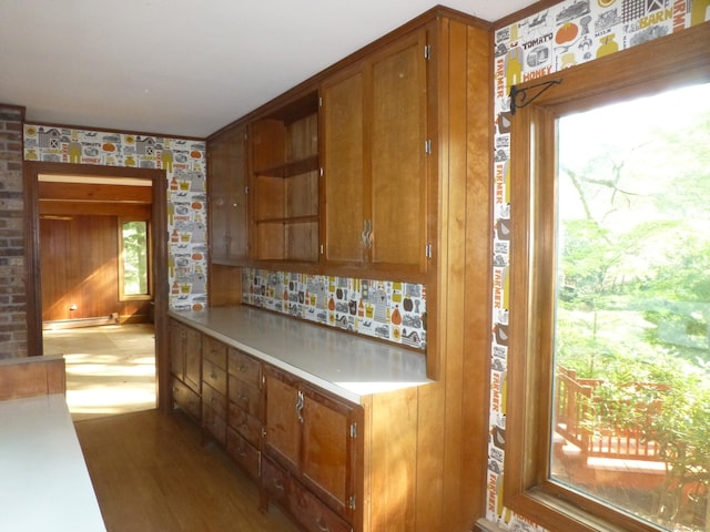 5 Tower Hill Lake Rd, Deep River, CT 06417 - kitchen featuring brown cabinets, wood finished floors, a baseboard radiator, light countertops, and decorative backsplash