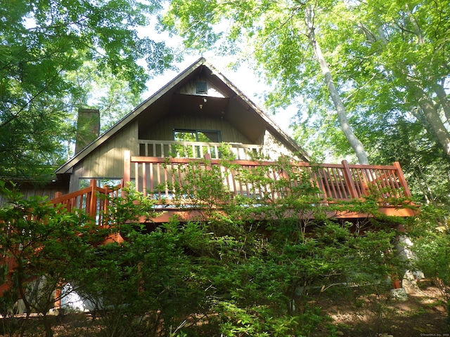 5 Tower Hill Lake Rd, Deep River, CT 06417 - rear view of house with a chimney and a deck