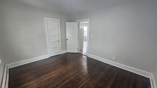 62 Miller St, New Britain, CT 06053 - empty room featuring dark wood-style floors and a baseboard radiator