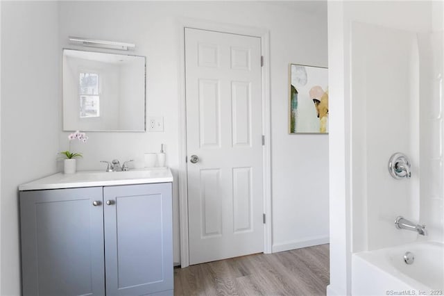 33 William St, Danbury, CT 06810 - bathroom featuring vanity, wood finished floors, and shower / washtub combination
