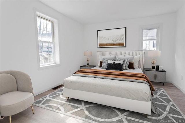 33 William St, Danbury, CT 06810 - bedroom with multiple windows and wood finished floors