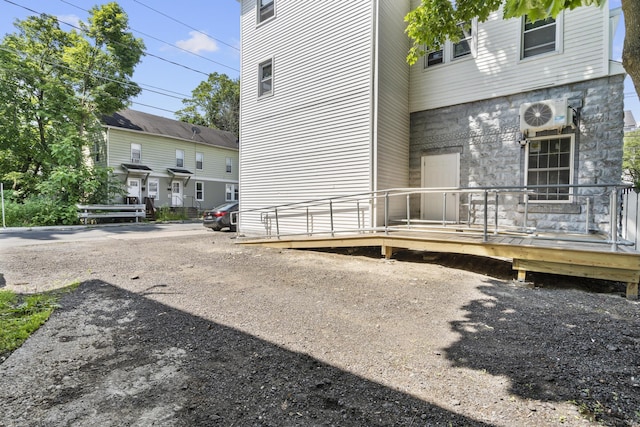 33 William St, Danbury, CT 06810 - view of home's exterior featuring a deck and stone siding