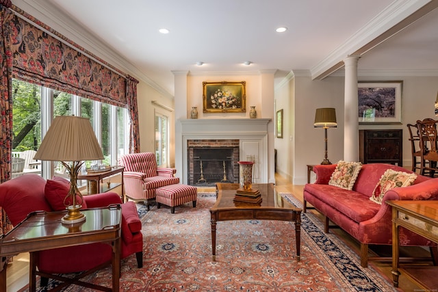 8 Up The Rd, Simsbury, CT 06092 - living room featuring crown molding, a fireplace, recessed lighting, ornate columns, and wood finished floors