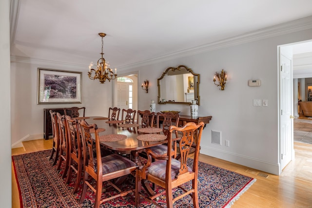 8 Up The Rd, Simsbury, CT 06092 - dining space with ornamental molding, a chandelier, and light wood-type flooring