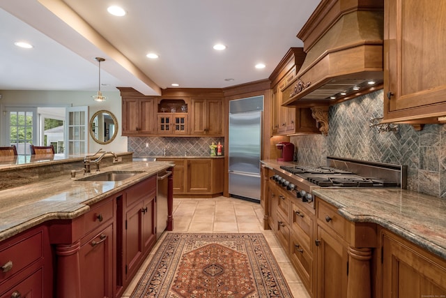 8 Up The Rd, Simsbury, CT 06092 - kitchen with brown cabinetry, appliances with stainless steel finishes, tasteful backsplash, light stone counters, and recessed lighting