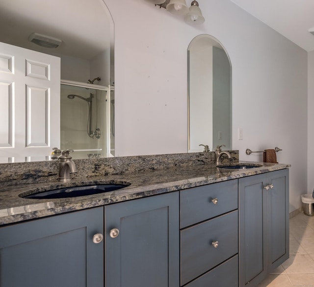 8 Up The Rd, Simsbury, CT 06092 - bathroom featuring double vanity, tile patterned floors, and a shower with shower door