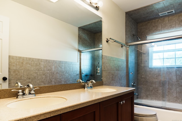 14 Last Leaf Cir Unit 14, Windsor, CT 06095 - bathroom with bath / shower combo with glass door, double vanity, and tile walls