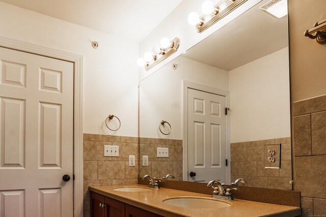14 Last Leaf Cir Unit 14, Windsor, CT 06095 - bathroom featuring tile walls, double vanity, and a wainscoted wall