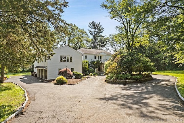 106A Comstock Hill Ave, Norwalk, CT 06850 - view of side of property with asphalt driveway and a garage