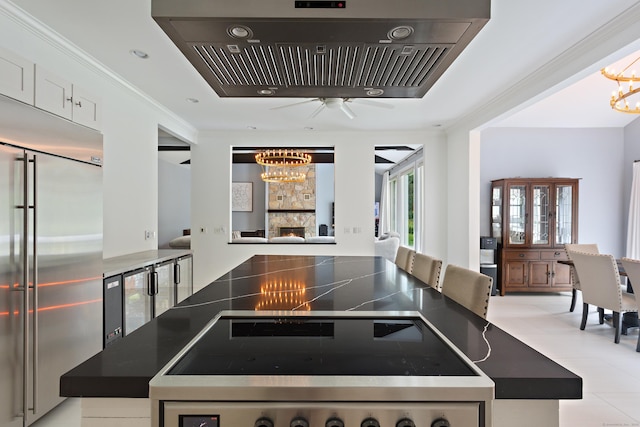 106A Comstock Hill Ave, Norwalk, CT 06850 - kitchen featuring a chandelier, built in refrigerator, dark countertops, ventilation hood, and ornamental molding