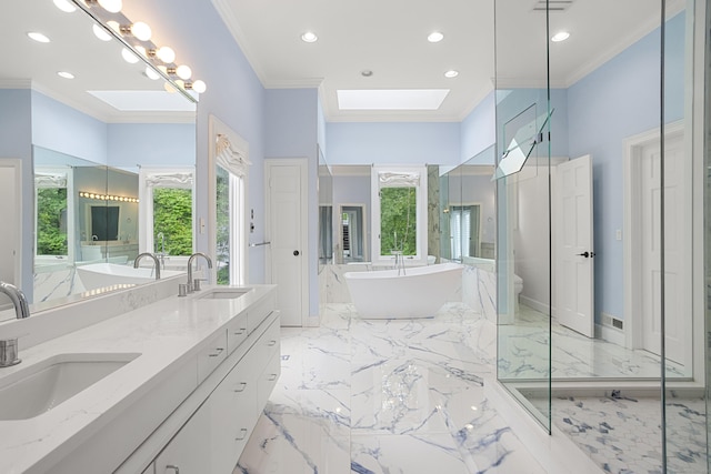 106A Comstock Hill Ave, Norwalk, CT 06850 - full bathroom with a skylight, marble tiled flooring, double vanity, ornamental molding, and a freestanding tub