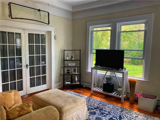 288 Benham Rd, Groton, CT 06340 - living area with healthy amount of natural light, wood finished floors, and french doors