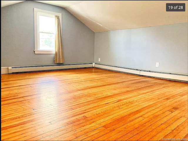 288 Benham Rd, Groton, CT 06340 - additional living space with hardwood / wood-style floors, vaulted ceiling, and a baseboard radiator