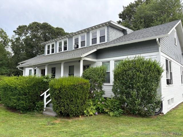 288 Benham Rd, Groton, CT 06340 - view of front of property featuring a front lawn, covered porch, and roof with shingles