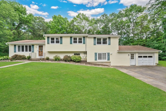 18 Arbor Rd, Monroe, CT 06468 - split level home featuring concrete driveway, a front yard, a garage, and view of scattered trees