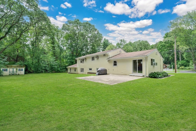 18 Arbor Rd, Monroe, CT 06468 - back of property with a patio area, a lawn, and a storage unit