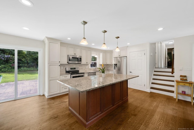 18 Arbor Rd, Monroe, CT 06468 - kitchen with appliances with stainless steel finishes, plenty of natural light, a kitchen island, dark wood-style floors, and recessed lighting